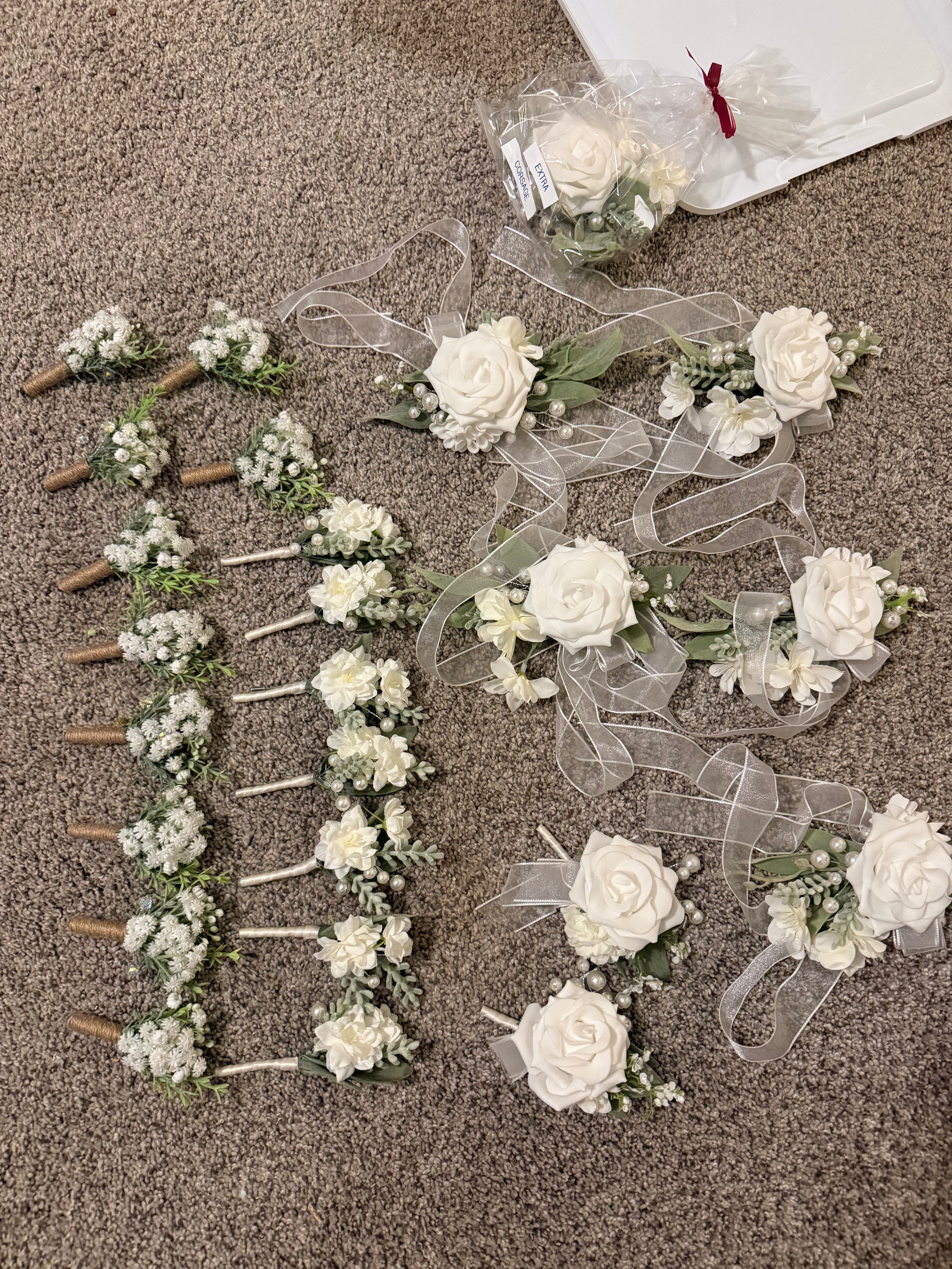 White permanent botanical boutonnieres and corsages