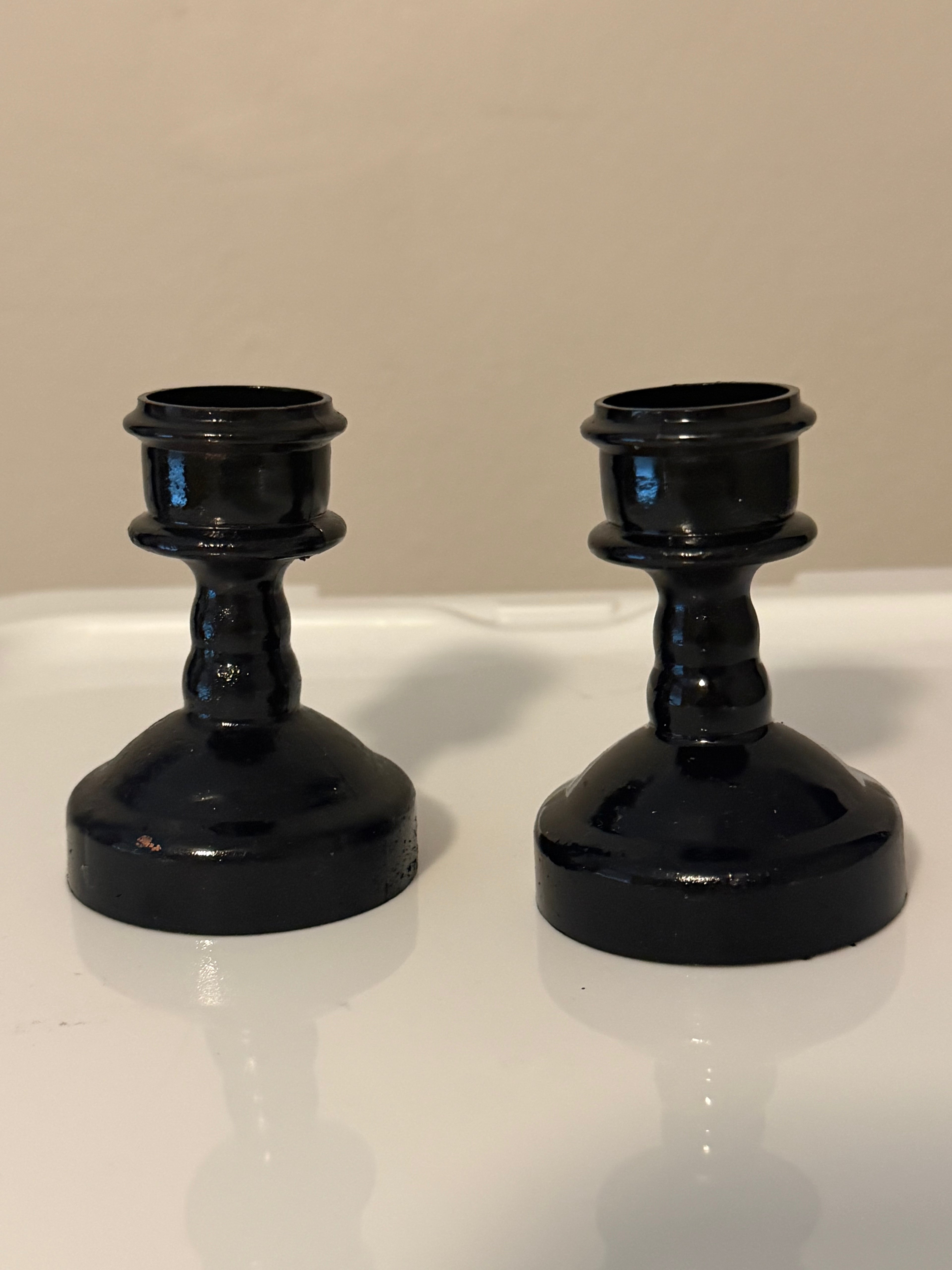 Set of 89 plastic taper candle bases - some have been painted black and some are bronze